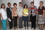Some $9,000 in grants were presented to three organizations chosen by the members.  Presenting and accepting the grants are, from left, Debbie Schmitz of MWC; Carolyn Chassee of East Jefferson General Hospital Foundation accepting grant for the Infusion Center; Evelyn Smith of MWC; Sue Rooney, MWC president; Karen Snyder of Covenant House; Gwynne Bowman of Chartwell Center, and Jerry Gast, MWC's co-chairman for Community Service.