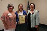 Cindy Garic, President, Emily Nichole Stark of Chapelle High School and Melanie Rose, Scholarship Chairman