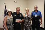 Community Service Grants - President Yvonne Perret, JPSO Lt. Craig Gardner, Ginger Crawford, Special Projects Chairman and Thomas Harvey of East Jefferson General Hospital EMS