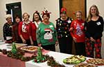 Hostesses December Cindy Enright, Caroline Bartolotta, Jerry Gast, Fran Puig, Lynn Courrege, Eleanor Hebert, June Prados and Heidi Burke