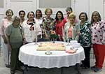 MWC 85th Anniversary from left Jerry Gast, Iona Myers, Joy Babin, Melanie Rose, Judy Wood, Coleen Landry, Yvonne Perret, Trish Seale, Carrel Epling, Linda Gallagher and  Cindy Garic