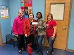 MWC Presentation to Hilda Knoff School - Patricia Seale, MWC President; Linda Morgan, Philanthropic Chairman; Leslie Turnbull, Princial of Hilda Knoff School; Liz Gurt