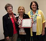 Membership Chairman Kit Lipps, Kathleen McGregor honored for 25 years of membership, and President Fran Puig